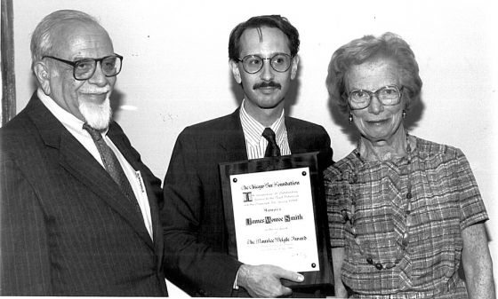 Founder James Monroe Smith (center) with Maurice Weigle, Jr. and his wife Helen Weigle, presenting Smith with the Weigle Award in 1989 at the Chicago Bar Association annual luncheon. 